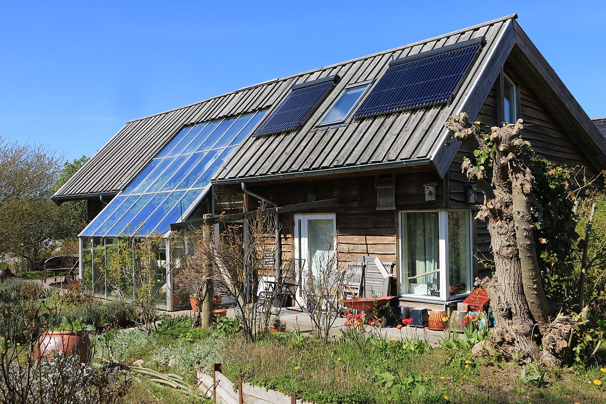 Mounted solar panels on the roof of a Danish ecovillage house.