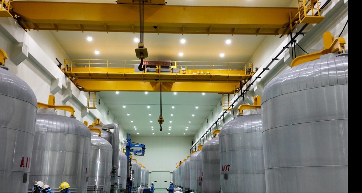 Polysilicon furnaces - large silver silos inside a factory room.