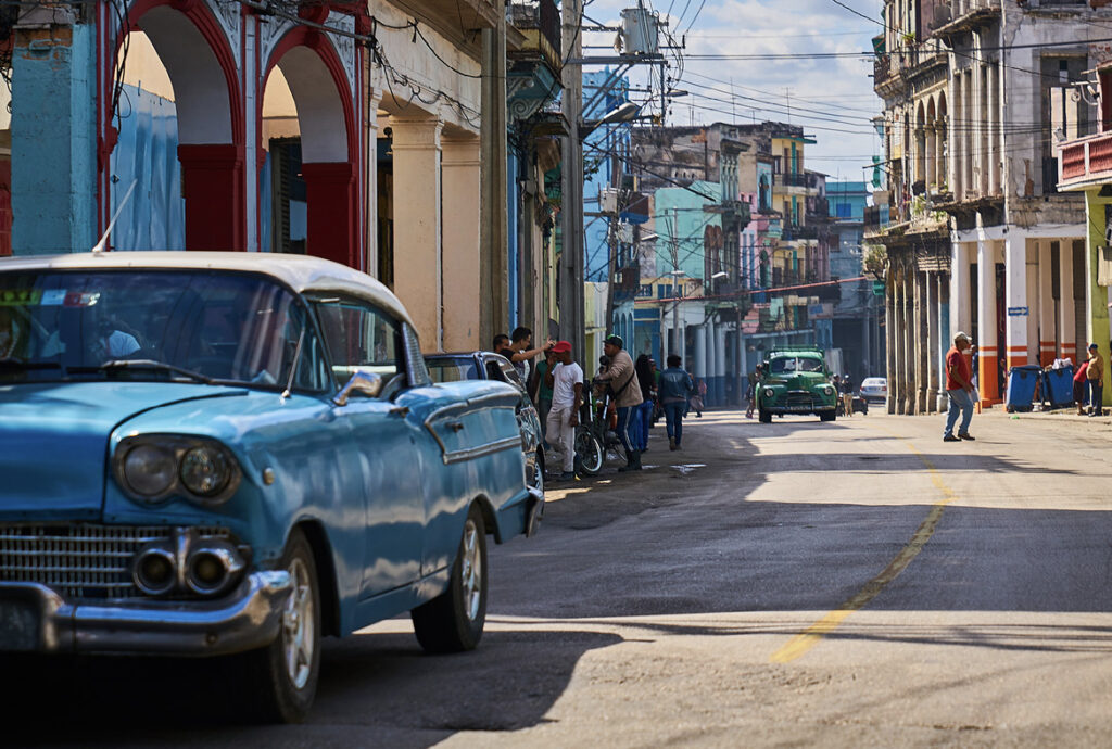 A street in Havana with old American style cars.