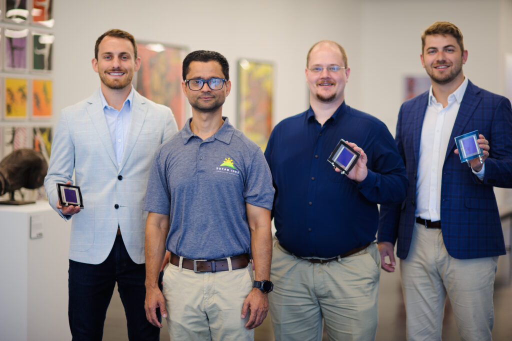 Sofab Inks employees holding the company's test cells