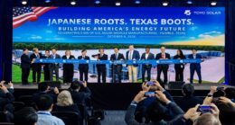 A large group of people cut the ribbon at Toyo Solar's Texas factory